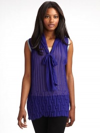 THE LOOKCrystal pleated sleeveless topChevron pleating at raw hemV-neckline with front tiesCharmeuse trim at neckline and armholesTHE FITAbout 29½ from shoulder to hemTHE MATERIALPolyesterSilk trimCARE & ORIGINDry cleanMade in Italy THE LOOKCrystal pleated sleeveless topChevron pleating at raw hemV-neckline with front tiesCharmeuse trim at neckline and armholesTHE FITAbout 29½ from shoulder to hemTHE MATERIALPolyesterSilk trimCARE & ORIGINDry cleanMade in Italy