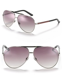 The great new look of Gucci. Here, the aviators are accented with the signature logo. Adjustable nose pads to help secure fit. The great new look of Gucci. Here, the aviators are accented with the signature logo. Adjustable nose pads to help secure fit.
