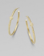 From the Jolie Collection. Elegantly fluted gold hoops, accented with gold beading and quatrefoil shapes set with sparkling diamonds.Diamonds, .12 tcw14k yellow goldDiameter, about 1½Post backImported
