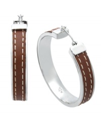 Traditional hoop earrings experience a taste of added luxury. Lauren by Ralph Lauren's trendy style incorporates a brown leather wrapping with a stitched overlay. Set in silver tone mixed metal. Approximate diameter: 1-1/4 inches. Traditional hoop earrings experience a taste of added luxury. Lauren by Ralph Lauren's trendy style incorporates a brown leather wrapping with a stitched overlay. Set in silver tone mixed metal. Approximate diameter: 1-1/4 inches.