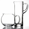 Simple, fluid glass forms with thick shams and hand cut polished edges. A sleek collection of pitchers for entertaining or everyday use. Lead free. Handwashing recommended. Shown from left to right: clear round pitcher, tall glass pitcher. Also available but not shown: Tula curved pitcher.