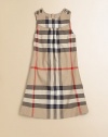 The classic check pattern adorns this plush cotton frock in an A-line silhouette with shoulder button detail.Round necklineSleevelessConcealed back zipperFront yokeA-line skirtCottonMachine washImported