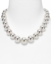 A single strand of metallic beads, graduated from small to large for a sleek, sophisticated silhouette.