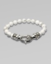 A new look for the modern man, handsomely crafted with a sterling silver raven's head clasp and a string of howlite beads.Sterling silverLobster claspBracelet, 9 longAbout 3 diamImported