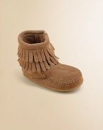 This ultra-comfortable, ultra-stylish boot is made in plush suede with a convenient side zip and layers of fringe for peace, love and fashion for your little one.Zip-upSuede upperRubber solePadded insoleImported