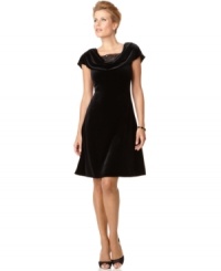 Patra's sumptuous velvet dress features a gorgeous cowl neckline with a sheer inset layer, bedecked with a dose of dazzling beading. Patra's sumptuous velvet dress features a gorgeous cowl neckline with a sheer inset layer, bedecked with a dose of dazzling beading.