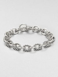 From the Chain Collection. Chunky oval links alternate between cable and smooth in this simple yet sophisticated style.Sterling silverLength, about 7.5Hidden spring clip claspMade in USA