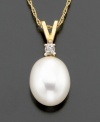 Supreme sophistication. A freshwater pearl (8-10 mm) with diamond accents beams on 14k gold V-shaped bale. Chain measures 16 inches; drop measures 5/8 inch.