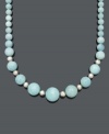 Smooth out your look in sweet, ocean-inspired style. This breezy necklace features graduated 8 to 20 millimeter aquamarine beads (480 ct. t.w.) with small, sterling silver accent beads and clasp. Approximate length: 18 inches.