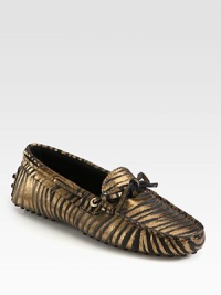 Moccasin-inspired silhouette of metallic leather takes on an exotic zebra print for a fashionable look. Zebra-print metallic leather upperLeather liningRubber solePadded insoleMade in Italy Moccasin-inspired silhouette of metallic leather takes on an exotic zebra print for a fashionable look. Zebra-print metallic leather upperLeather liningRubber solePadded insoleMade in Italy