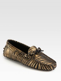 Moccasin-inspired silhouette of metallic leather takes on an exotic zebra print for a fashionable look. Zebra-print metallic leather upperLeather liningRubber solePadded insoleMade in Italy