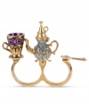 Pour yourself a cup of chic style. Betsey Johnson's two-finger ring highlights a gold tone and silver glitter teapot, gold tone and purple glitter teacup and gold tone spoon with crystal accent. Crafted in antiqued gold tone mixed metal. Size 7-1/2.
