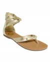 The G by Guess Lorzi Flat Sandals add a bit of diva styling to the summer essential with beaded straps, a glowing finish and a trendy closed ankle.