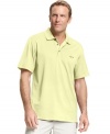 This polo by Greg Norman for Tasso Elba not only showcases your sense of style but also supports your skills out the course.