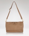 We're all about versatile style this spring, particularly when it looks like this foldover leather messenger from Tory Burch. For the girl who likes to keep her options open, this bag boasts an extendable shape and multi-functional straps.