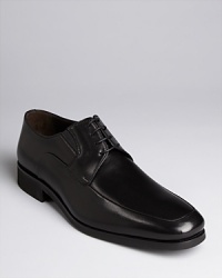 An icon of fashionable prominence, these Bruno Magli dress shoes are made of luxe Italian leather. Lace-up oxfords with elastic inserts for comfortable movement. Fine topstitching details. An icon of fashionable prominence, these Bruno Magli dress shoes are made of luxe Italian leather. Lace-up oxfords with elastic inserts for comfortable movement. Fine topstitching details.