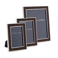 Supple alligator-embossed leather pairs with crisp, clean polished silver plate to give this Ralph Lauren Home frame striking textural contrast. Supple alligator-embossed leather pairs with crisp, clean polished silver plate to give this Ralph Lauren Home frame striking textural contrast.