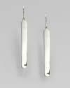 From the Saddle Collection. Exquisitely simple, subtly curved elongated ovals of polished sterling silver, sleek and shining. Sterling silverLength, about 1½Ear wireImported