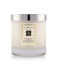 This enchanting essence, inspired by a sun-drenched morning in an English country garden, perfectly captures the scent of jasmine, lily, orange flower and rose on the morning breeze. An unexpected twist of soft and sensual wild mint stimulates the senses and teases the palette in this elegant and eccentric fragrance. The White Jasmine & Mint Home Candle infuses any room with evocative scent and lasts for hours. An everyday luxury, it brings warmth to any environment. 200g. This enchanting essence, inspired by a sun-drenched morning in an English country garden, perfectly captures the scent of jasmine, lily, orange flower and rose on the morning breeze. An unexpected twist of soft and sensual wild mint stimulates the senses and teases the palette in this elegant and eccentric fragrance. The White Jasmine & Mint Home Candle infuses any room with evocative scent and lasts for hours. An everyday luxury, it brings warmth to any environment. 200g.