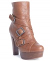 Edgy and cool. Thick straps and bulky buckles add masculine texture to GUESS's Latrice booties.