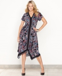 A vibrant paisley print and handkerchief hem lend an exotic look to INC's easy plus size dress. A vibrant paisley print and handkerchief hem lend an exotic look to INC's easy plus size dress.