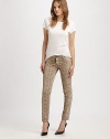 Reversible, snake-print leggings with five-pocket styling and a shiny finish. To maintain this waxy look, freeze cleaning is recommended. Button closureZip flyFive-pocket stylingRise, 8Inseam, about 3095% cotton/3% spandex/2% elasterellFreeze cleanMade in USA of imported fabricModel shown is 5'10 (177cm) wearing US size 4. To freeze clean: Spot clean stains and air dry. Fold lengthwise and place in zip lock bag. 