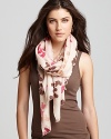 A cute multicolored squirrel pattern accents this oblong scarf from Lola Rose.