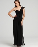 Lending feminine flair, a flourish of ruffles adorns the front of this Amsale one-shoulder gown.