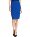 Look sharp! Alfani's faux leather-trimmed pencil skirt instantly adds modern polish to your wardrobe.