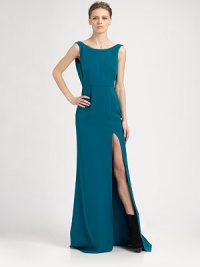High slit and plunging cowlback add a hint of sultry to this floor-length gown. BoatneckSleevelessFront slitCowlbackFully linedAbout 47 from natural waistPolyesterDry cleanImportedModel shown is 5'10 (177cm) wearing US size 2. High slit and plunging cowlback add a hint of sultry to this floor-length gown. BoatneckSleevelessFront slitCowlbackFully linedAbout 47 from natural waistPolyesterDry cleanImportedModel shown is 5'10 (177cm) wearing US size 2.