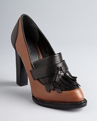 Rachel Roy gives the menswear-influenced oxford trend a femme spin, in lofty heels with kiltie details. Rachel Roy gives the menswear-influenced oxford trend a femme spin, in lofty heels with kiltie details.