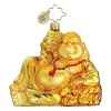 A happy buddha in bright gold with a shining red bead necklace.