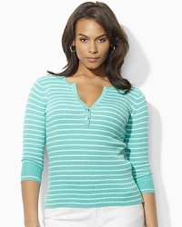 A deep split neckline finished with silver-toned buttons lends modern allure to a classic striped Henley in soft ribbed cotton. A deep split neckline finished with silver-toned buttons lends modern allure to a classic striped Henley in soft ribbed cotton.