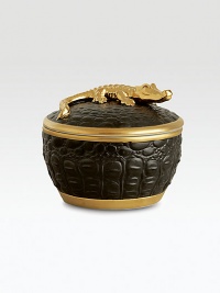 A candle with the intoxicating scent of pink champagne is encased in this vessel with the texture of crocodile skin, handcrafted of fine black Limoges porcelain with 14k goldplated accents. Includes fitted lid with a clasp sculpted in the shape of an crocodile. Handcrafted porcelain 6H X 4 diam. Imported A candle with the intoxicating scent of pink champagne is encased in this vessel with the texture of crocodile skin, handcrafted of fine black Limoges porcelain with 14k goldplated accents. Includes fitted lid with a clasp sculpted in the shape of an crocodile. Handcrafted porcelain 6H X 4 diam. Imported