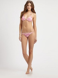 A classic swim top featuring an irresistible pastel print and glamorous gold hardware. The triangle cups can be adjusted for a flawless fit. Halter strap ties at neckTriangle cupsGold hardwareBack tie closureFully lined80% nylon/20% Lycra®Hand washMade in USA of imported fabric Please note: Bikini bottom sold separately. A classic swim top featuring an irresistible pastel print and glamorous gold hardware. The triangle cups can be adjusted for a flawless fit. Halter strap ties at neckTriangle cupsGold hardwareBack tie closureFully lined80% nylon/20% Lycra®Hand washMade in USA of imported fabric Please note: Bikini bottom sold separately.