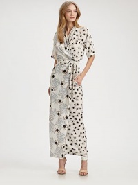 An elongated version of your favorite DVF wrap dress all in pretty floral-print silk.Gathered necklineDropped shouldersShort sleevesWrap frontSelf-beltAbout 37 from natural waistSilkDry cleanImportedModel shown is 5'9 (175cm) wearing US size 4.OUR FIT MODEL RECOMMENDS ordering true size. An elongated version of your favorite DVF wrap dress all in pretty floral-print silk.Gathered necklineDropped shouldersShort sleevesWrap frontSelf-beltAbout 37 from natural waistSilkDry cleanImportedModel shown is 5'9 (175cm) wearing US size 4.OUR FIT MODEL RECOMMENDS ordering true size.