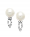 Classic meets contemporary for a stylish touch. These earrings are crafted from 10k white gold and bring together a cultured freshwater pearl (6 mm) with single-cut diamonds (1/10 ct. t.w.).  Approximate drop: 1/2 inch. Approximate width: 1/4 inch.