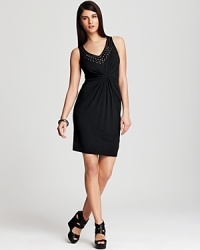 Work the party circuit with captivating sophistication in this Karen Kane dress, touting a delicately embellished neckline and masterfully pleated front for modern elegance. Work the party circuit with captivating sophistication in this Karen Kane dress, touting a delicately embellished neckline and masterfully pleated front for modern elegance.