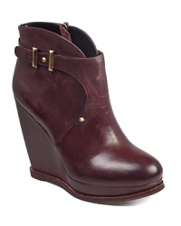 With subtle studded details, Sam Edelman's Dalton wedge boots show off a tall silhouette with belted accents. With subtle studded details, Sam Edelman's Dalton wedge boots show off a tall silhouette with belted accents.
