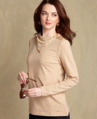 A new spin on the turtleneck: Tommy Hilfiger's top features a button-up collar with shining goldtone buttons for a casual look gone chic. A new spin on the turtleneck: Tommy Hilfiger's top features a button-up collar with shining goldtone buttons for a casual look gone chic.