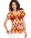 Bright and bold, this Lucky Brand Jeans peasant top features a punchy print that livens up jeans or a skirt instantly!