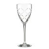 Diamond-shaped cuts delicately catch the light in these classic wine glasses from kate spade.