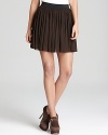 Lightweight mesh lends effortless movement to a pleated Vince Camuto skirt for an elevated approach to this season's sporty-chic trend.