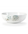 Romance blossoms at tables with the Silk Floral vegetable bowl. Modern, fuss-free porcelain from Mikasa bears artsy garden blooms in teal and cream for a look of serene grace and femininity.