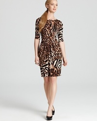 Lead the fashion pack in this Karen Kane dress ablaze with a graphic cheetah print. Tame the style with polished pumps for safari-chic approach to your 9-to-5. Lead the fashion pack in this Karen Kane dress ablaze with a graphic cheetah print. Tame the style with polished pumps for safari-chic approach to your 9-to-5.