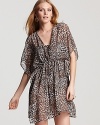 Take the animal print trend poolside with Profile's v neck tunic. Get spotted -- this dress is cabana chic with a solid suit and cat-eye frames.