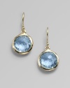 From the Lollipop Collection. Exquisitely faceted blue topaz drops, framed in gleaming 18k yellow gold. Blue topaz 18k yellow gold Drop, about 1 Diameter, about ½ Ear wire Imported