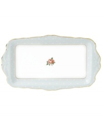 Royal Albert updates a classic with the playfully patterned Polka Rose sandwich tray. Dainty dots mix with  Old Country Roses on gold-banded bone china with a dainty ruffled edge.