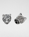 Wild about style, these antiqued sterling silver cuff links are crafted in a tiger's head and paw design.Sterling silverPaw-shaped backAbout .67 diam.Made in USA
