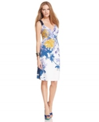 An oversized floral print brings bright summer style to this T Tahari dress for a look that's boldly beautiful! An oversized floral print brings bright summer style to this T Tahari dress for a look that's boldly beautiful!